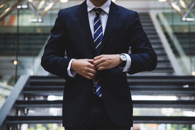 a suited man on stairs